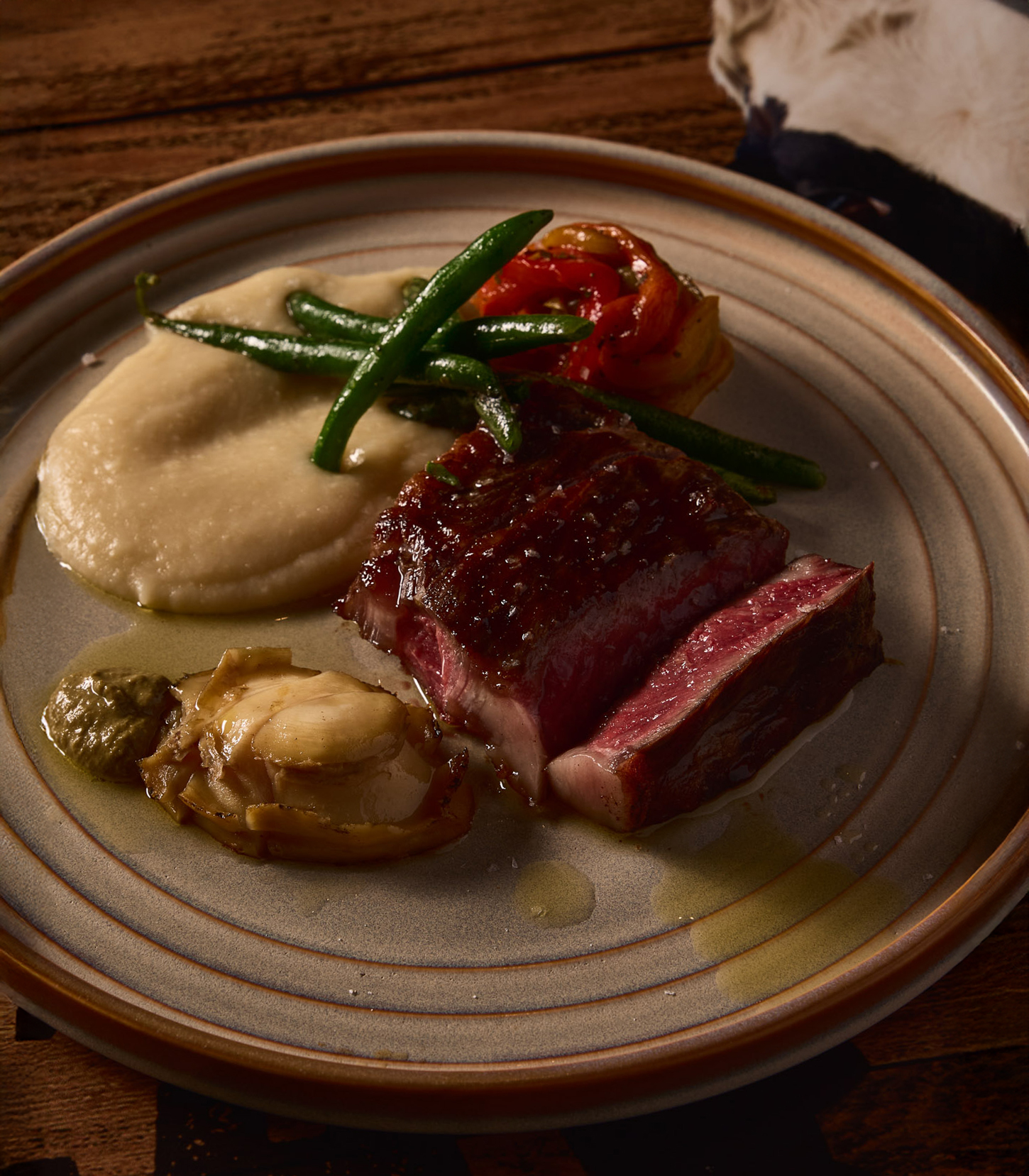FIFTH COURSE:
Parrilla wood fire grilled Wagyu MB5 eye fillet,
82c slow cooked greenlip abalone, marinated pepper, celeriac cream, charred beans, and chimichurri