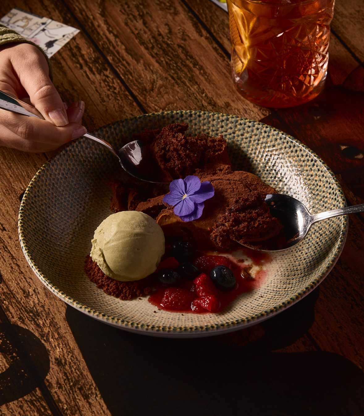 SIXTH COURSE:
Chocotorta, macerated berries, and pistachio gelato