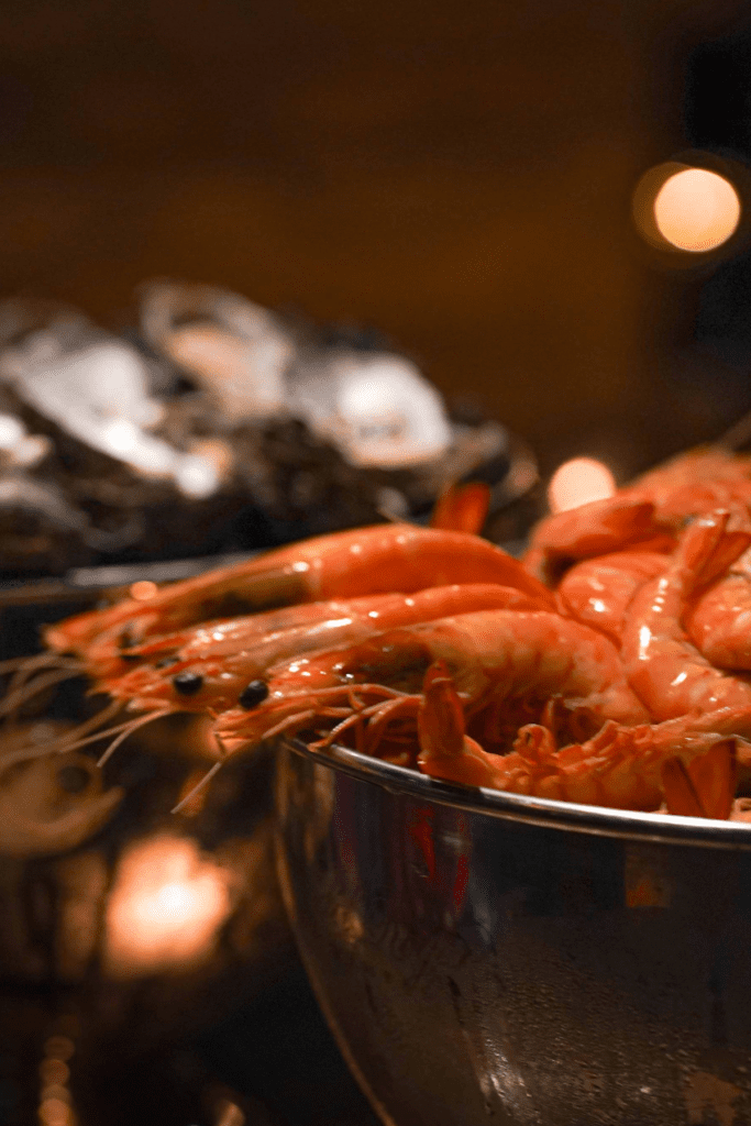 Close-up of fresh prawns and seafood on display.